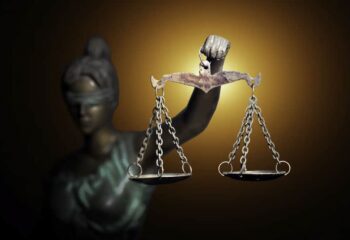 Lady Justice figure with scales highlighted