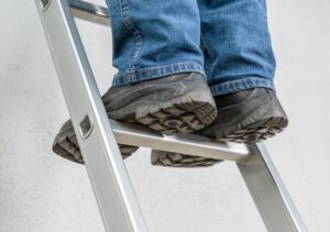 Construction Accident Lawyers In Los Angeles-person standing on a ladder