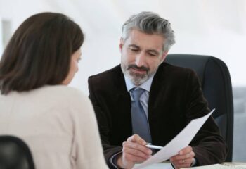 injury attorney meeting client in office