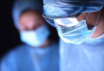 surgeons working in an operating room