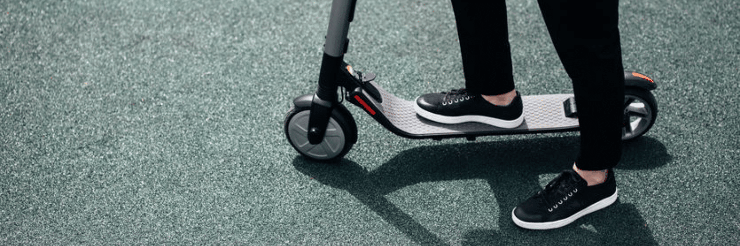 teen riding e-scooter