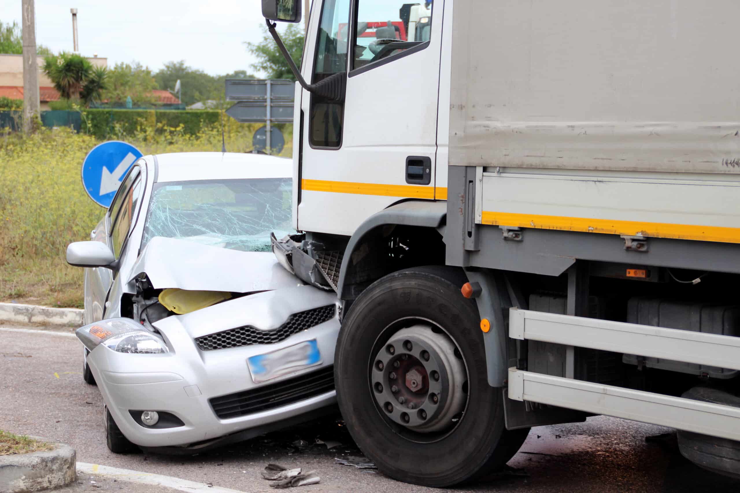 truck crashing into small car