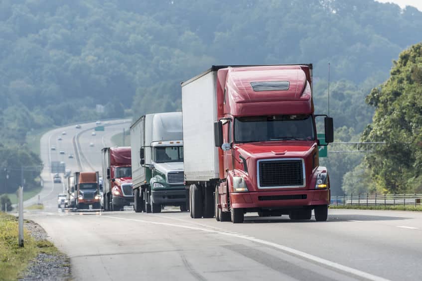 semitrucks driving on highway