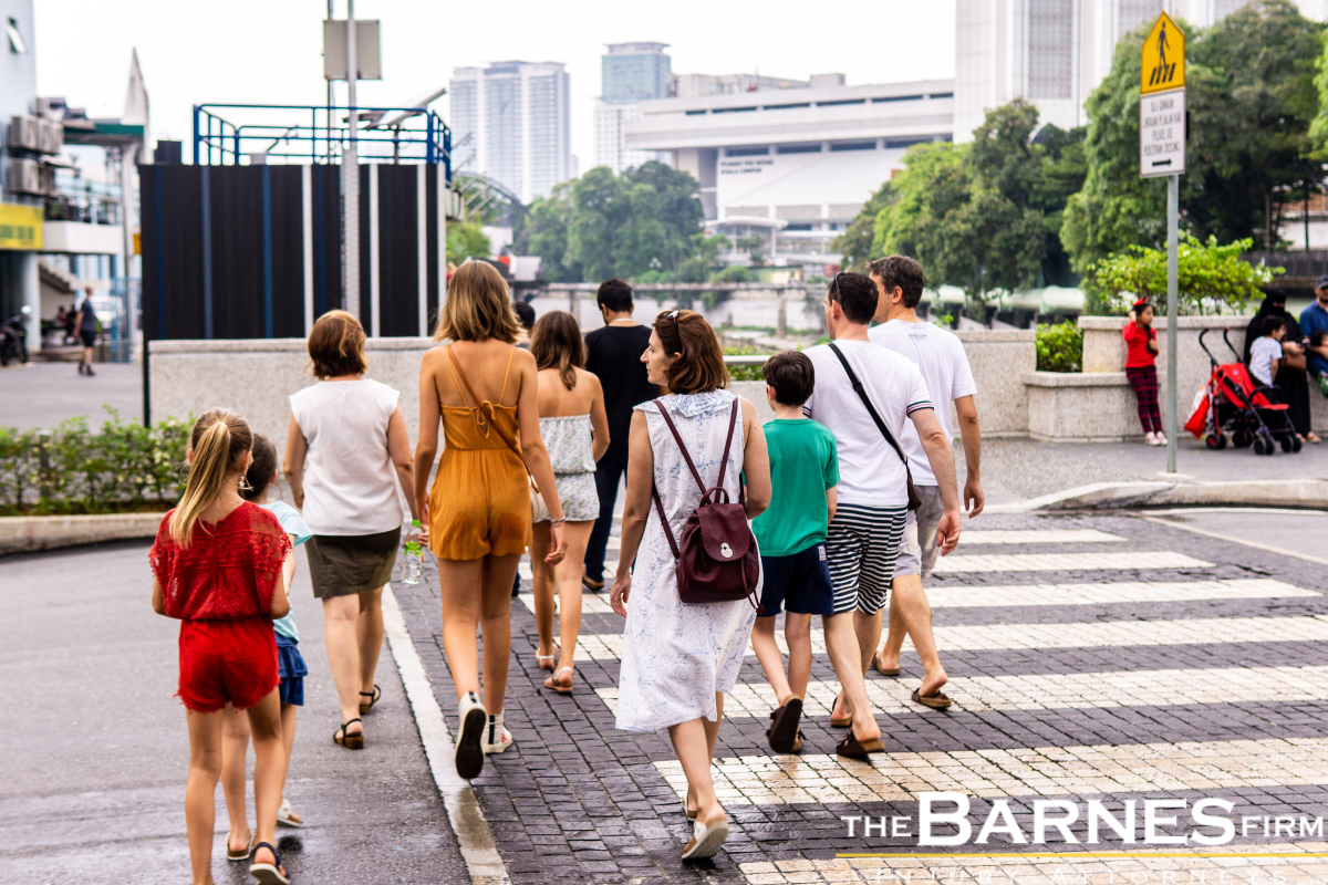 A crowd of pedestrians crossing the street