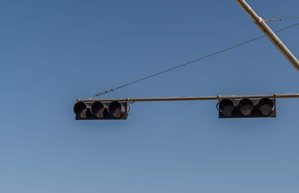 if a traffic signal light is not working, you must