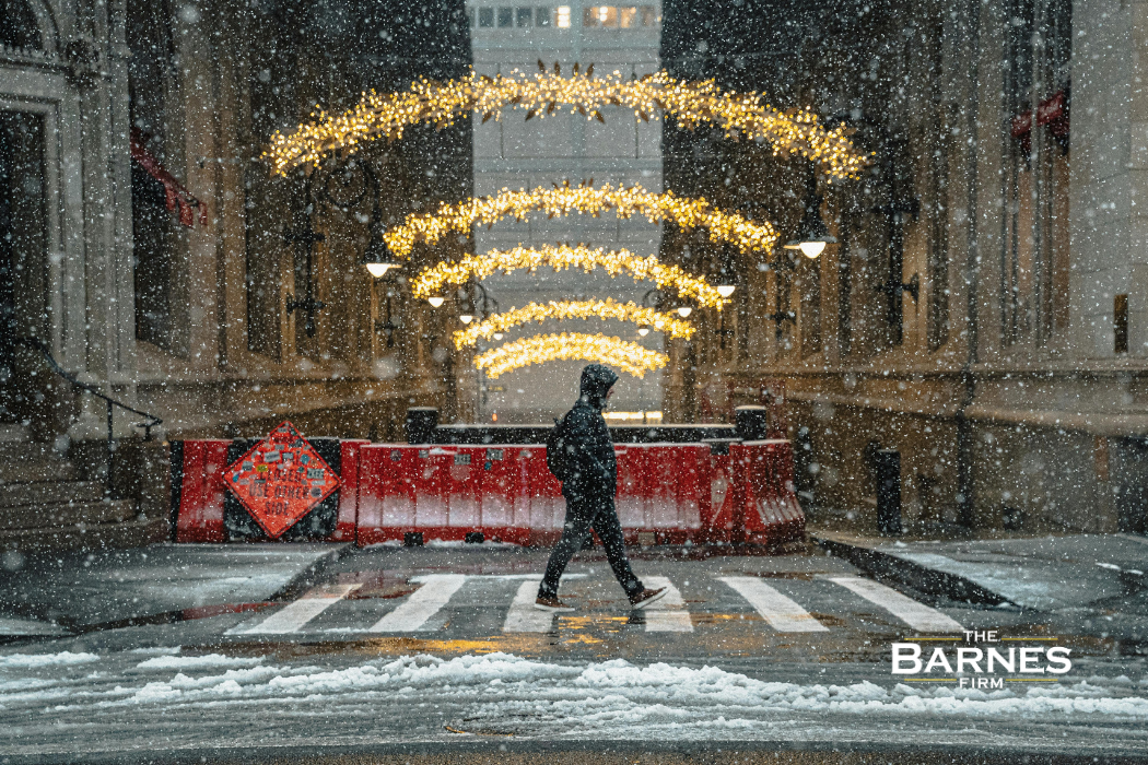 man walking on a snow covered sidewalk in nyc