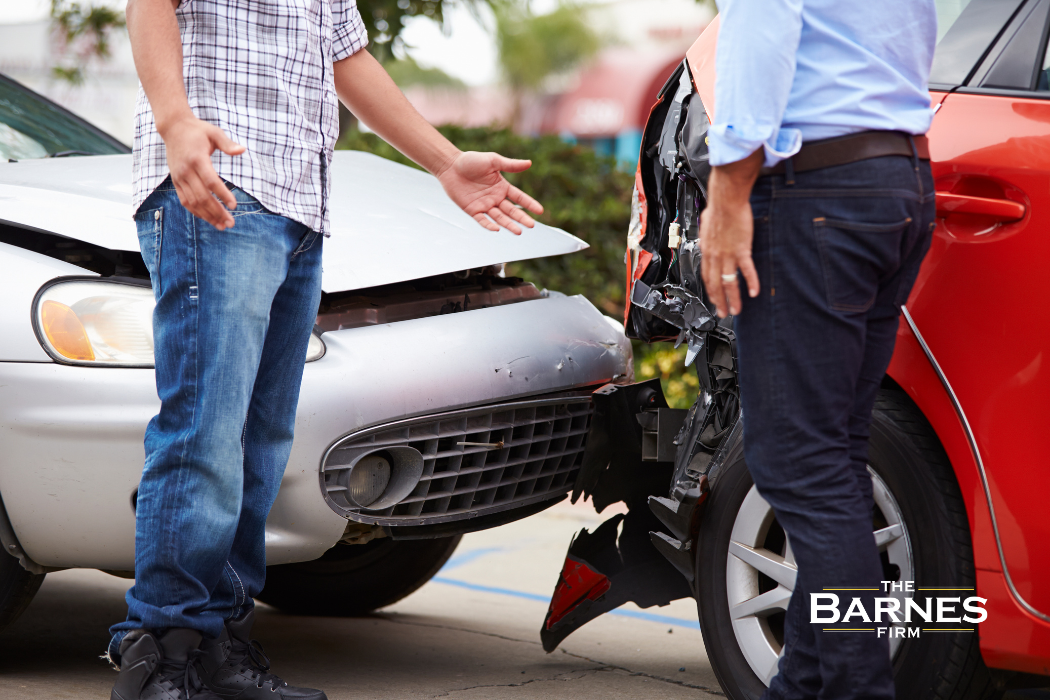 two people exchanging information after a car accident